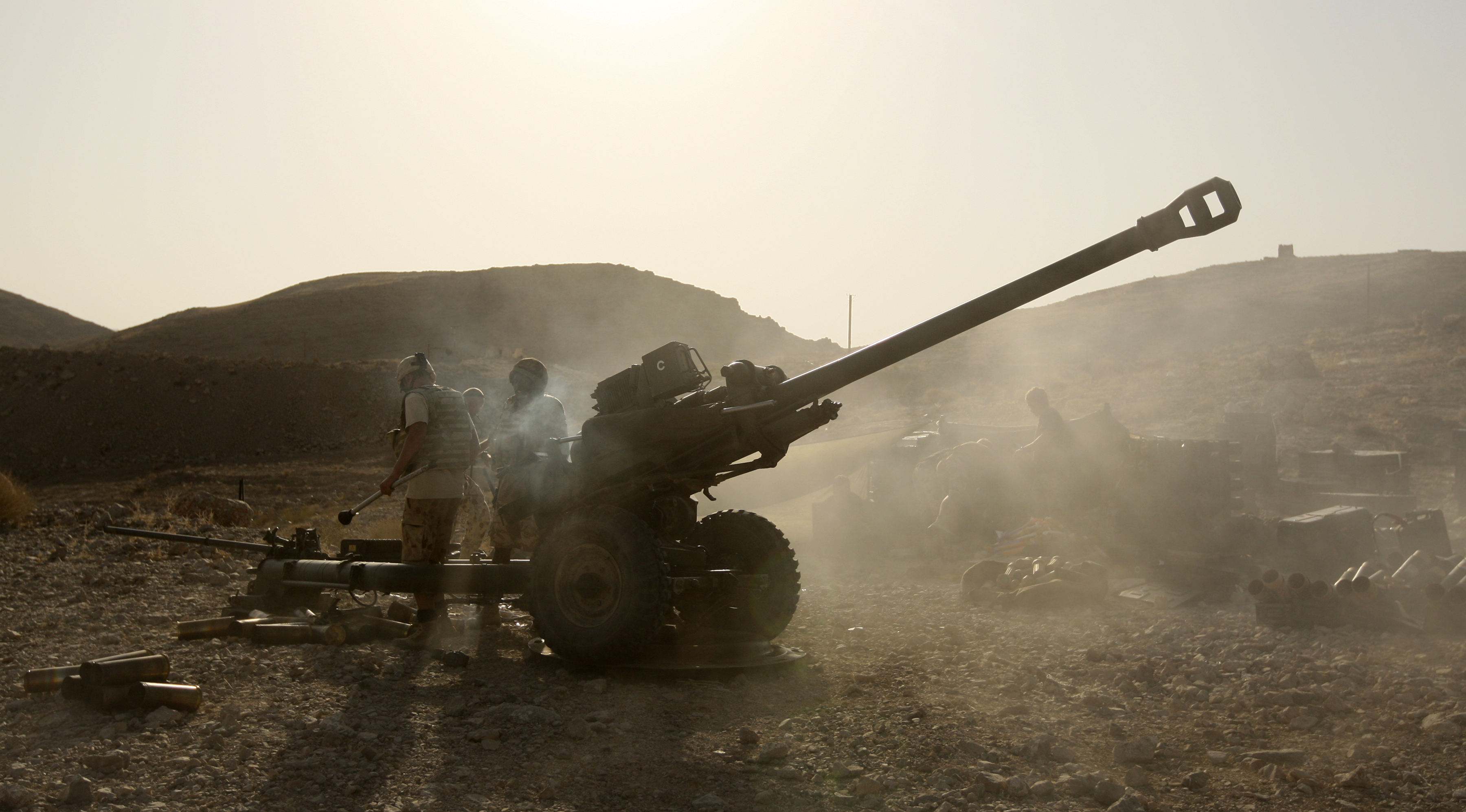 ISAF Soldiers Fire a 105mm Light Gun